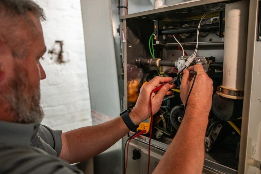 A Jolly tech providing professional electrical installation services.