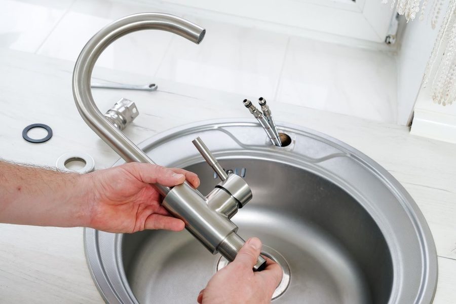 Sink faucet removed for repairs by plumber.