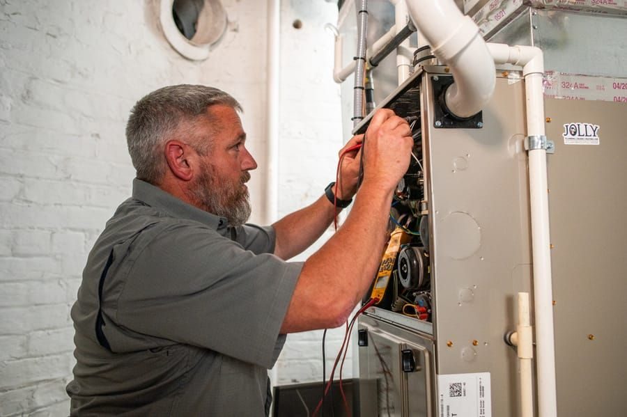 Jolly Pro rewiring electrical components in a home.